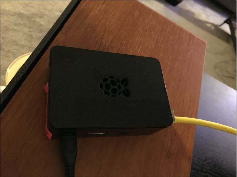 The Raspberry Pi we used. The black USB cable goes to power and the yellow Ethernet cable was used to provide internet access to the Pi.